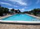 Community pool with plenty of lounge chairs at 5408 Swift Rd # 28, Sarasota, FL 34231
