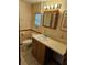 Bathroom featuring vanity with mirror and decorative wallpaper at 407 White Oak Way, Sarasota, FL 34237