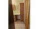 Bathroom with vanity, cabinet and closet with louvered doors at 407 White Oak Way, Sarasota, FL 34237