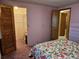 View of bedroom with an open closet, and entrance to bathroom at 407 White Oak Way, Sarasota, FL 34237