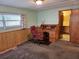 Bedroom area with desk and chair, including doorway to bathroom at 407 White Oak Way, Sarasota, FL 34237