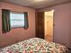 Bedroom with open walk-in closet and window at 407 White Oak Way, Sarasota, FL 34237