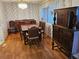 Dining area featuring hardwood floors, floral wallpaper, and dark wood furniture at 407 White Oak Way, Sarasota, FL 34237
