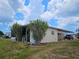 View of side of home with covered parking at 407 White Oak Way, Sarasota, FL 34237