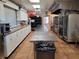 A large, well-equipped commercial kitchen with stainless steel countertops, ovens, and ample storage space at 407 White Oak Way, Sarasota, FL 34237