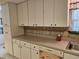 Spacious kitchen featuring ample cabinet space, updated countertops, and modern appliances at 407 White Oak Way, Sarasota, FL 34237