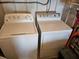 Close-up of laundry machines set against wall at 407 White Oak Way, Sarasota, FL 34237