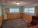 Spare room with carpeted floor and light coming in from a trio of windows at 407 White Oak Way, Sarasota, FL 34237