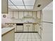 Condo kitchen with white cabinets, tile floor, and stainless steel appliances at 3438 Wood Owl Cir # 275, Bradenton, FL 34210