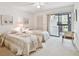 Guest bedroom with two twin beds and private balcony access at 3438 Wood Owl Cir # 275, Bradenton, FL 34210