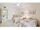 Guest bedroom with twin beds and view into hallway at 3438 Wood Owl Cir # 275, Bradenton, FL 34210