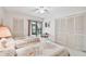 Guest bedroom with two twin beds and private balcony at 3438 Wood Owl Cir # 275, Bradenton, FL 34210
