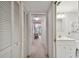 Hallway with built-in storage and bathroom access at 3438 Wood Owl Cir # 275, Bradenton, FL 34210