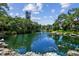Serene pond with a fountain, enhancing the community landscape at 3438 Wood Owl Cir # 275, Bradenton, FL 34210