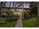 Two-story condo building, brick paver pathway, lush landscaping at 3438 Wood Owl Cir # 275, Bradenton, FL 34210