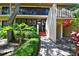 Condo building entrance with brick walkway, lush landscaping at 3438 Wood Owl Cir # 275, Bradenton, FL 34210