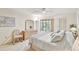 Main bedroom with king bed, private balcony, and built-in dresser at 3438 Wood Owl Cir # 275, Bradenton, FL 34210