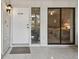 Exterior view showing condo entrance with sliding glass door offering a peek into the bedroom at 3438 Wood Owl Cir # 275, Bradenton, FL 34210