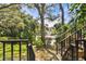 Steps lead to a serene backyard oasis with pond and fountain views at 3438 Wood Owl Cir # 275, Bradenton, FL 34210