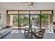 Bright dining area with glass table and view of nature at 3438 Wood Owl Cir # 275, Bradenton, FL 34210