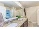 Elegant bathroom with dual sinks and granite countertops at 16904 Vardon Ter # 108, Bradenton, FL 34211