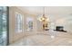 View from dining area of living space with fireplace and wet bar at 7430 Weeping Willow Dr, Sarasota, FL 34241