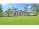 Single-Gathering home with lush landscaping at 7430 Weeping Willow Dr, Sarasota, FL 34241