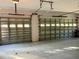 Garage features matching double doors with windows and plenty of natural light at 7430 Weeping Willow Dr, Sarasota, FL 34241