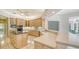 Kitchen with island, granite counters, breakfast bar, and stainless steel appliances at 7430 Weeping Willow Dr, Sarasota, FL 34241