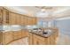 Spacious kitchen with island, plenty of cabinets and breakfast bar seating at 7430 Weeping Willow Dr, Sarasota, FL 34241
