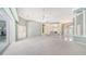 Spacious open-concept living area leading to foyer and screened patio at 7430 Weeping Willow Dr, Sarasota, FL 34241