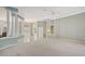 Open-concept living area with high ceilings, large columns and lots of natural light at 7430 Weeping Willow Dr, Sarasota, FL 34241