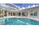 Screened-in pool and outdoor space extends from the house and covered patio at 7430 Weeping Willow Dr, Sarasota, FL 34241