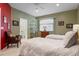 Bright bedroom with twin beds and access to a full bath at 7371 Regina Royale # 11, Sarasota, FL 34238