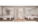 Elegant bathroom with double vanities and a large mirror at 70 Avenida Veneccia # 402, Sarasota, FL 34242