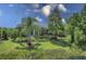 House with lush landscaping and a pond in the backyard at 7336 Haddington Cv, Bradenton, FL 34202
