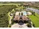 Resort-style pool and clubhouse with surrounding landscape at 7336 Haddington Cv, Bradenton, FL 34202