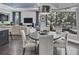 Bright breakfast nook features a round table and chairs, offering a view of the backyard at 7336 Haddington Cv, Bradenton, FL 34202