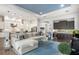 Open floor plan with a large sectional sofa and adjacent kitchen at 7336 Haddington Cv, Bradenton, FL 34202
