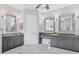 Luxurious Primary bathroom with granite countertops, dual vanities, and large mirrors at 7336 Haddington Cv, Bradenton, FL 34202