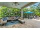 Relaxing lanai with wicker furniture and pool view at 7336 Haddington Cv, Bradenton, FL 34202