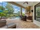 Outdoor entertaining space with pool, grill, and seating at 7336 Haddington Cv, Bradenton, FL 34202