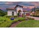 Elegant home with manicured landscaping and brick driveway at 7336 Haddington Cv, Bradenton, FL 34202