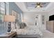 Spacious main bedroom with light blue walls and a ceiling fan at 7336 Haddington Cv, Bradenton, FL 34202