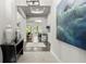Bright and spacious entryway with hardwood floors and large artwork at 7336 Haddington Cv, Bradenton, FL 34202