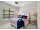 Bright bedroom featuring a comfortable bed and large window at 7336 Haddington Cv, Bradenton, FL 34202