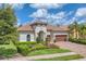 Luxury home with a two-car garage and well manicured landscaping at 7336 Haddington Cv, Bradenton, FL 34202