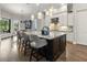 Modern kitchen with granite island, stainless steel appliances, and breakfast bar at 7336 Haddington Cv, Bradenton, FL 34202