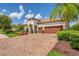 Stunning curb appeal, two-car garage, and beautifully landscaped yard at 7336 Haddington Cv, Bradenton, FL 34202