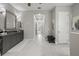 Spa-like bathroom with marble flooring and access to hallway at 7336 Haddington Cv, Bradenton, FL 34202